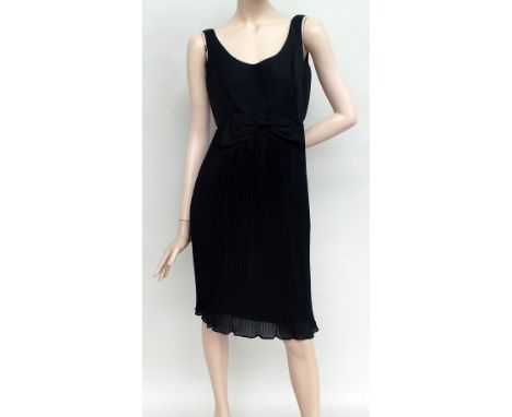 Three 1950s/60s dresses. A 1960s 'Linzi Line' black lined cocktail frock. Concertina pleated skirt below a fitted empire line