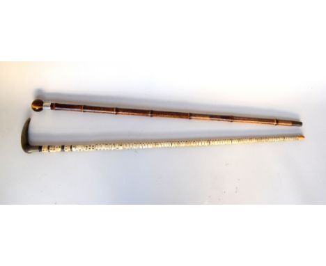 A late 19th century shark spine walking stick with metal core (87cmL) together with a late Victorian tiger's eye and silver m