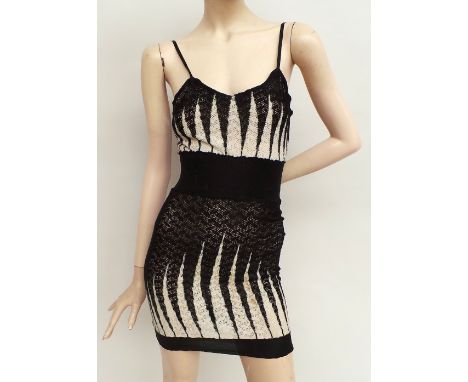Three pieces of 1920s undergarments. A fabulous fine wool woven all-in-one with fitted salmon pink top and zig-zag contrastin