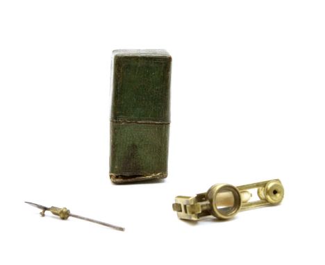 A 19th century pocket microscope, the brass instrument with bone handle lens, specimen holder, in a leather case, 6.5cm high 