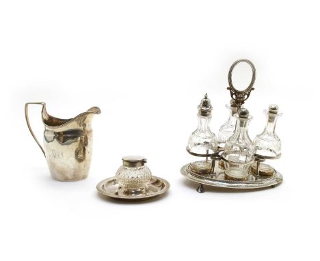 Three silver items comprising a Georgian helmet shaped cream jug, London 1915, a Victorian cruet set, London 1862, with four 