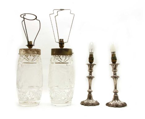 A pair of cut-glass table lamps, vases 30cm high, overall 53cm high and a pair of silver-plated candlestick table lamps, 29cm