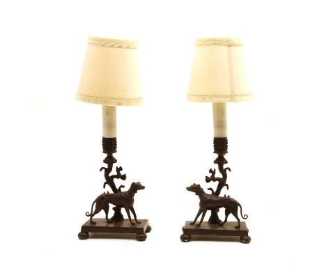 A pair of cast bronze candlestick scones/lamps,with hounds, 13cm wide x 39cm high including shades (2)Condition report: Later