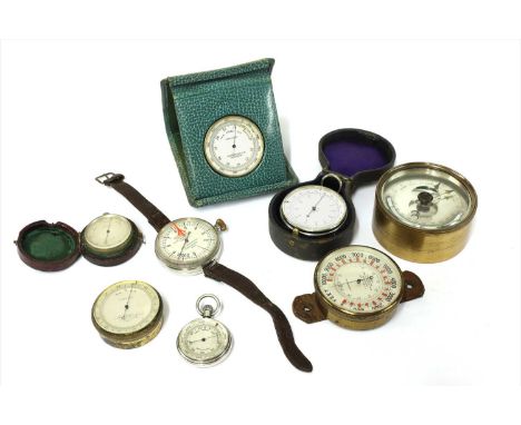 Seven pocket aneroid barometers, the first inscribed John Barker &amp; Co Ltd, Kensington, in leather desk stand,the second c