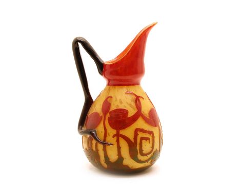 A Schneider Le Verre Francais cameo glass pitcher, c.1925, in the Spirales pattern, with acid cut foliage over a mottled ochr