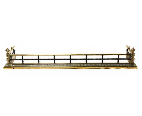 A brass and steel fire curb, late 19th century, with ring turned and rosette decoration, and turned ball finials, 154cm wide,