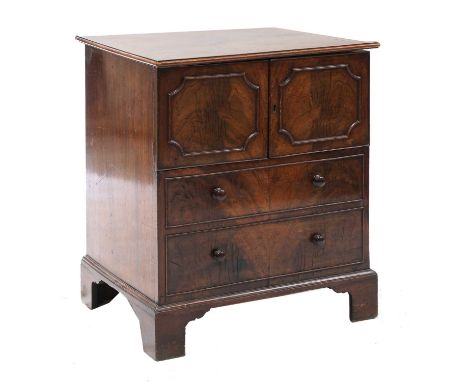 A mahogany commode chest,19th century with panelled doors and on bracket feet,62cm wide50cm deep73cm highCondition report: Ol