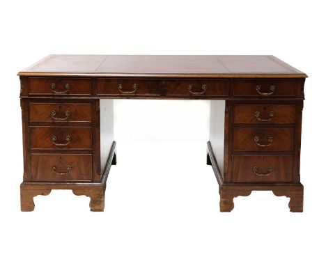 A mahogany pedestal Partners desk, 20th century, the red leather inset top inset over nine various drawers and cupboards to t