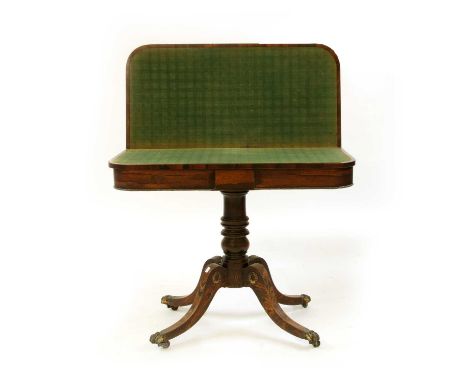A Regency rosewood fold-over card table, the strung and crossbanded top on a faux rosewood column and four outswept legs, 90c