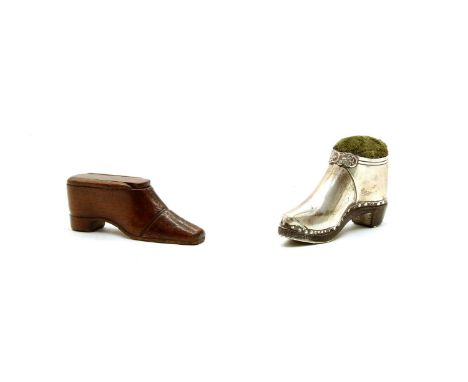 A late Victorian silver patent pin cushion shoe by Sampson Morden &amp; Co, an oak sole and heel and embossed buckle, Birming