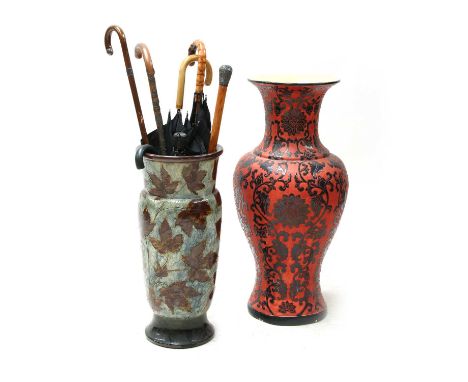 A Royal Doulton autumnal foliage stick stand, with an assortment of canes, sticks and umbrellas, together with a modern Chine