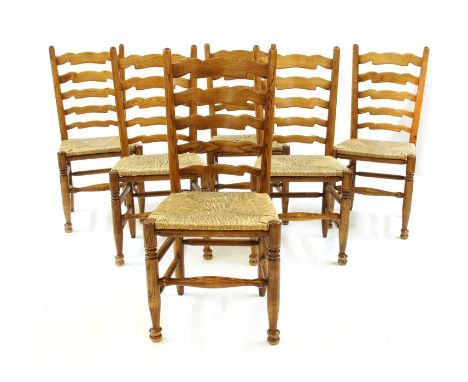 A good set of six modern ash ladder back single chairs, with drop-in rush seats, 103cm high (6)Condition report: No obvious m