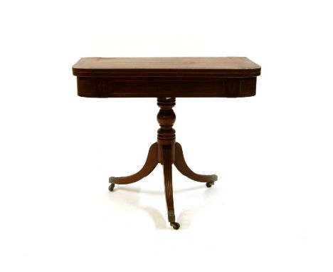 A George IV mahogany pedestal card table, on a turned column and three swept legs with leaf cast terminal casters, 89cm wide,