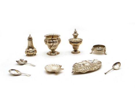 A collection of silver items, to include a sterling silver leaf dish, together with a shell salt, two caddy spoons, a further