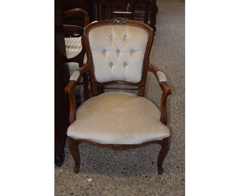 A button back upholstered elbow chair