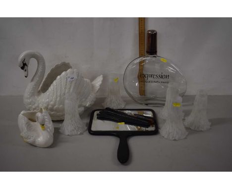 A large ceramic model of a swan together with five small frosted glass shades and a smaller ceramic model of a swan