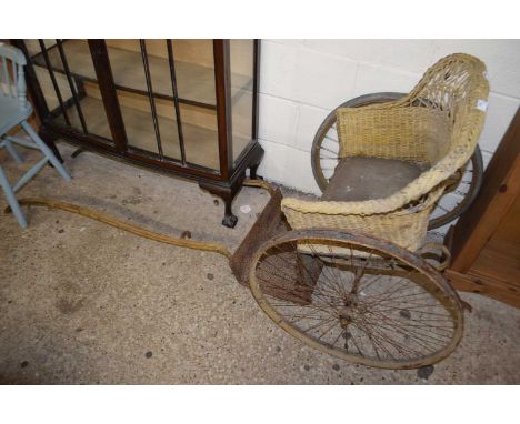 Small vintage two wheeled pony trap with wicker seat