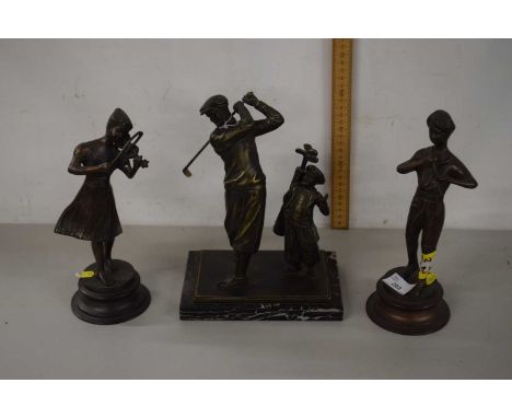 Four metal figures including two figures of musicians on circular bases and further model of a golfer and caddy on rectangula