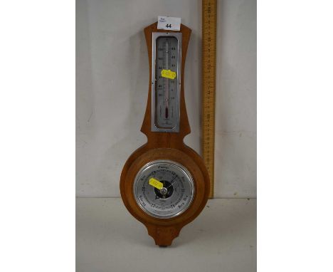 A wall mounted barometer