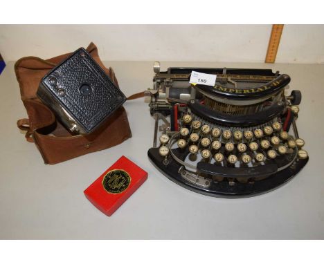 An Imperial B typewriter together with a vintage camera