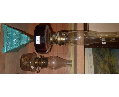 Oil lamp on ceramic base and coloured reservoir and another (2)