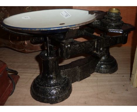 Pair of cast metal and enamel kitchen scales