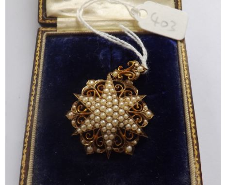 Attractive late Victorian 9ct. seed pearl star pendant,  30mm long, contained in a fitted box    