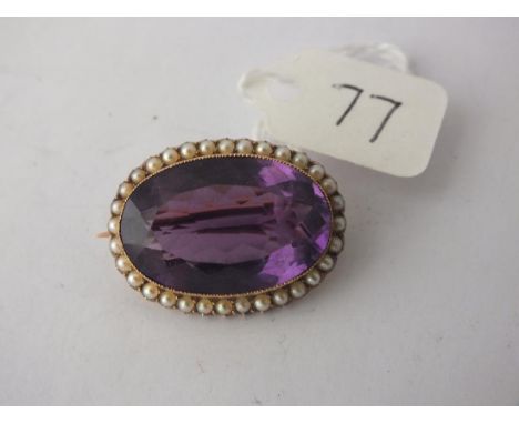 Oval, amethyst and pearl set antique   brooch 9ct gold.         