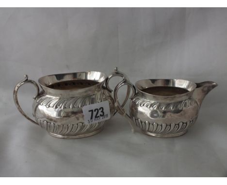Oval half swirl reeded cream jug and matching sugar  basin, 5" over handles Shef 1891 305g.    