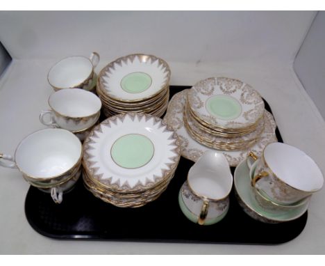 A tray of two part bone china tea services by Harrowby and Ashley 