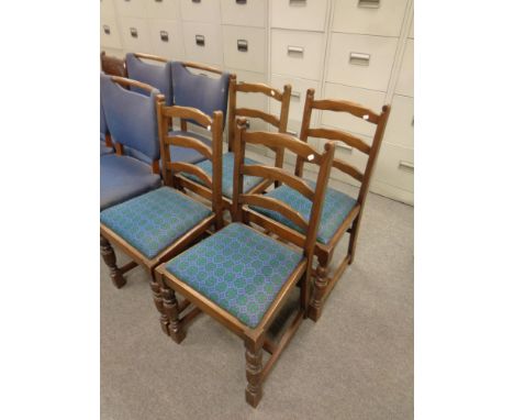 A set of four oak ladder backed chairs 