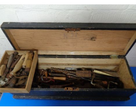 A vintage pine joiner's tool box containing assorted tools to include brace, chisels, spanners, drill bits etc 