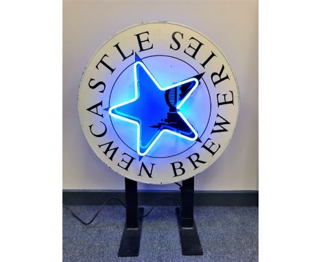 A vintage metal double-sided and illuminated Newcastle Breweries adverting sign mounted on bracket, diameter 63cm.  CONDITION