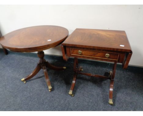 A reproduction mahogany sofa coffee table and a similar circular table 