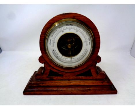 An early 20th century oak holosteric barometer    