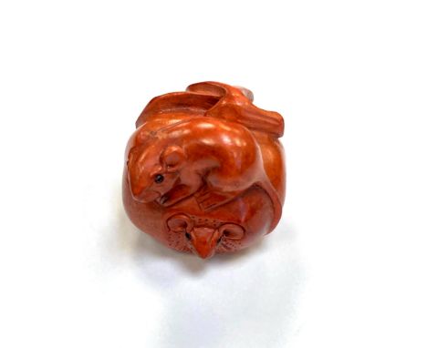 A Japanese carved fruitwood netsuke - Rats on a pumpkin. 