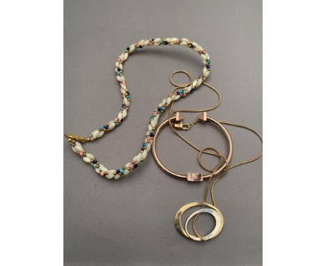A beaded necklace together with a bangle in rose gold coloured finish, pendant on chain 