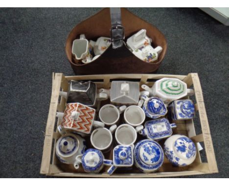 A crate and leather caddy containing Ringtons teapots, coffee pots, water jugs, mugs etc 