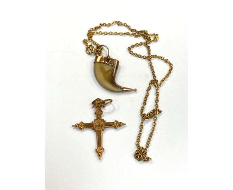 A continental yellow gold cross pendant, 4.3g, together with a claw pendant suspended on a chain. (2)