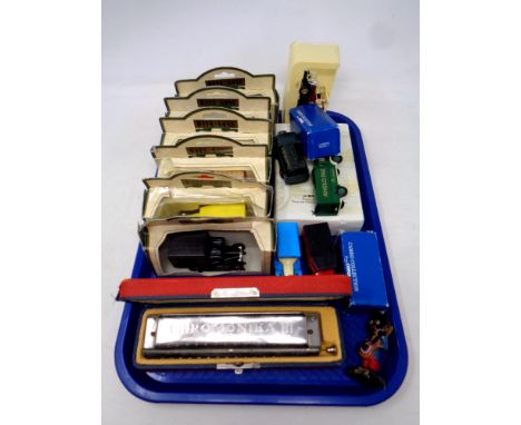 A tray of boxed and unboxed die cast Corgi vehicles, Days gone, Robertsons band Golly, Hohner Chromonica III