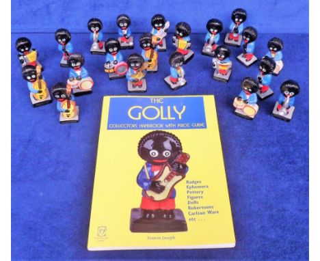 Robertson's Golly Band Figures and reference book, 21 plaster figures with a label to the base stating 'Hand Painted Foreign'