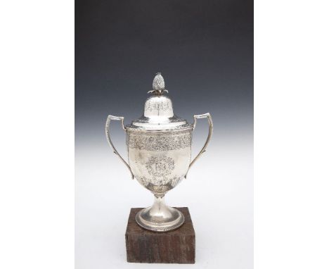 AN IRISH WILLIAM IV SILVER TWO HANDLE CUP AND COVER, Dublin 1834, the domed cover with pineapple finial over a demi ovoid bod