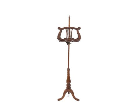 AN IRISH MAHOGANY ADJUSTABLE MUSIC STAND, 19th Century, stamped Strahan and Co. 64490, the double-sided lyre shaped supports 