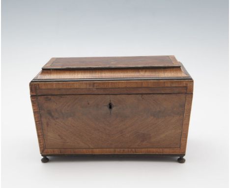 A GEORGE IV INLAID MAHOGANY SARCOPHAGUS SHAPED TEA CADDY, decorated with rosewood banding, the interior fitted  twin compartm