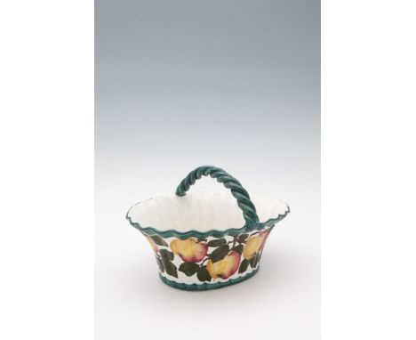 A SCOTTISH WEMYSS WARE FRUIT BASKET, applied with arched rope twist handle to a lobed handle painted with fruits and foliage 