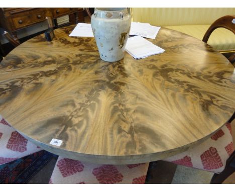 A FINE WILLIAM IV FLAME-MAHOGANY TILT TOP BREAKFAST TABLE, c. 1835, the circular top with radial segment veneers, supported o