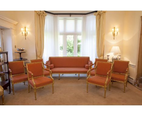 A SUITE OF LOUIS SEIZE STYLE GILTWOOD FRAMED SALON SEAT FURNITURE comprising a set of six armchairs and a matching three seat