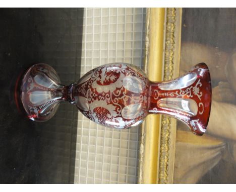 A BOHEMIAN RUBY AND CLEAR GLASS VASE of baluster form. 30cm high