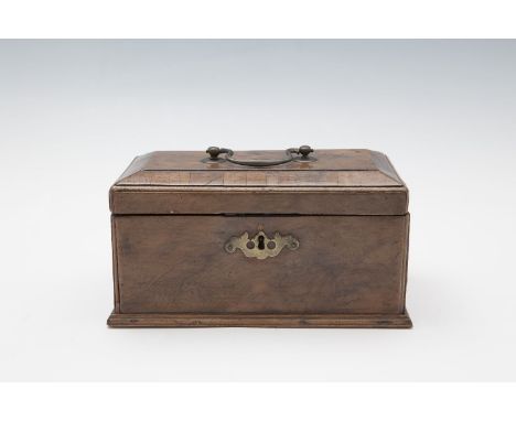 A GEORGE III YEW WOOD RECTANGULAR TEA CADDY with hinged lid and brass handle, the interior fitted with three zinc containers.