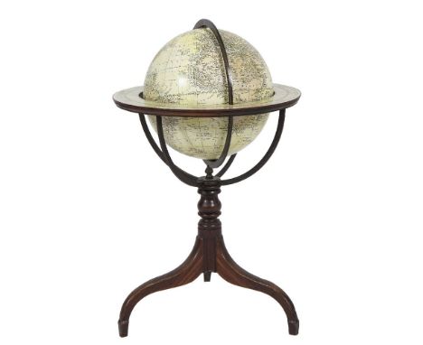 A TERRESTRIAL GLOBE by Woodward, within a border of printed months and zodiac within an iron frame and raised on turned centr